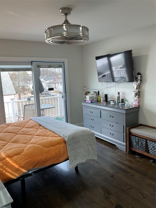 bedroom with dark wood-type flooring and access to outside