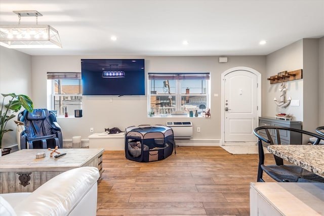 living room featuring light hardwood / wood-style floors and heating unit