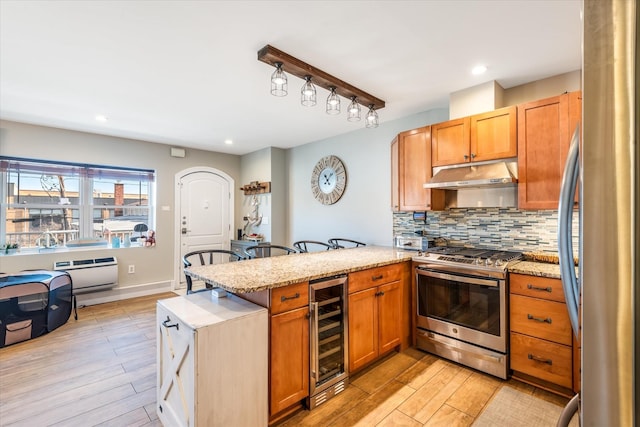 kitchen with stainless steel appliances, tasteful backsplash, light stone countertops, light hardwood / wood-style floors, and beverage cooler