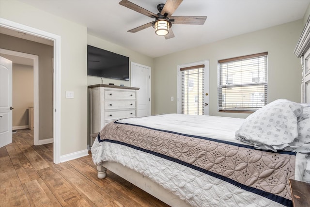 bedroom with ceiling fan, access to outside, and light wood-type flooring