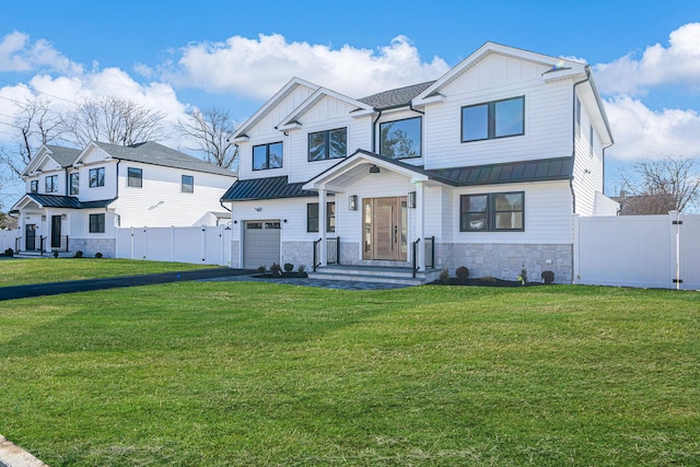 view of front of house with a garage and a front yard