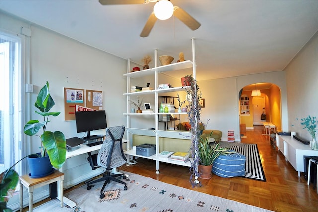 office space featuring parquet floors and ceiling fan