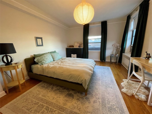 bedroom featuring wood-type flooring