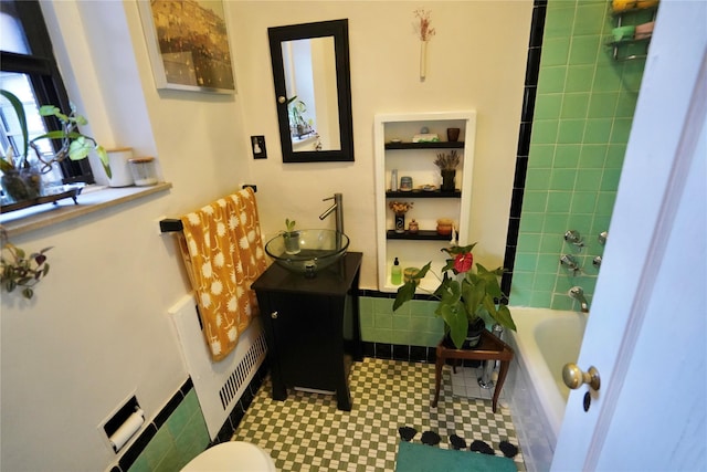 bathroom with built in shelves, vanity, and toilet