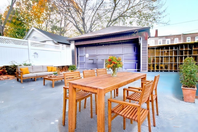 view of patio featuring a garage and an outdoor structure