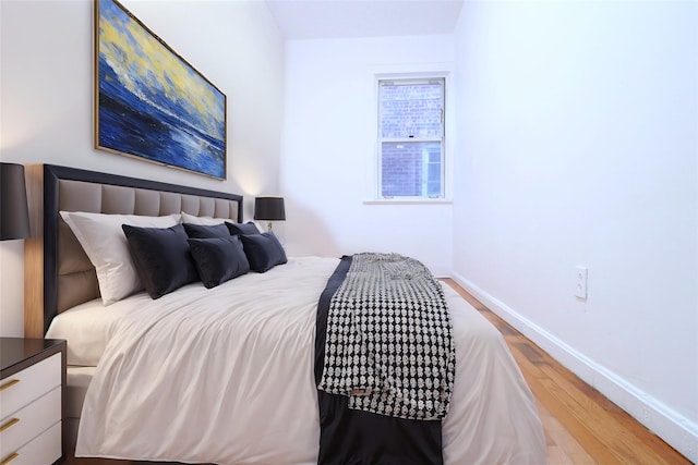 bedroom featuring hardwood / wood-style flooring