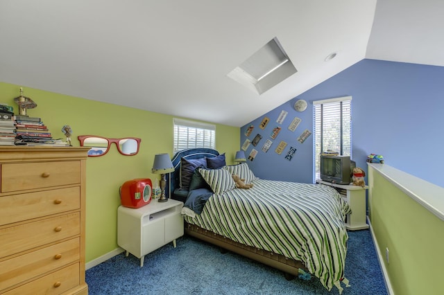 bedroom featuring multiple windows, carpet, and lofted ceiling