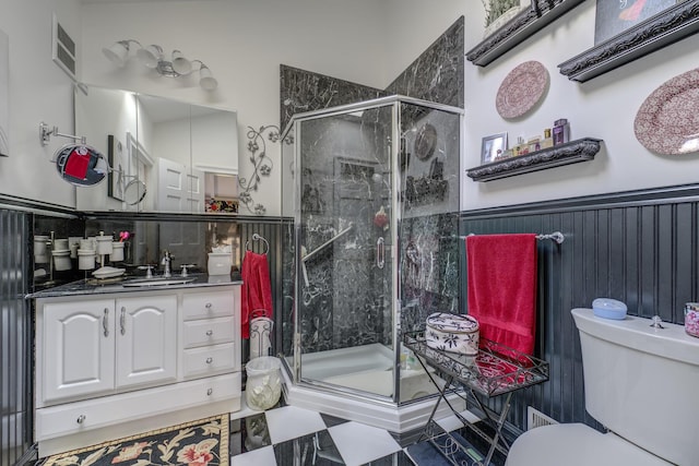 121 Laurel Ln, Laurel Hollow, NY 11791 - bathroom with toilet, a stall shower, a wainscoted wall, and vanity