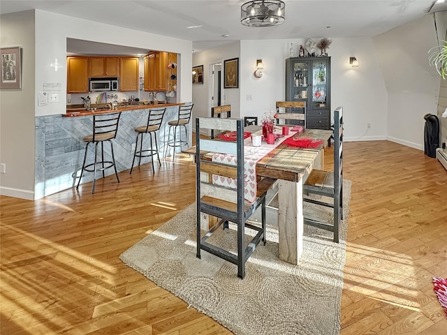 dining area featuring light wood-type flooring