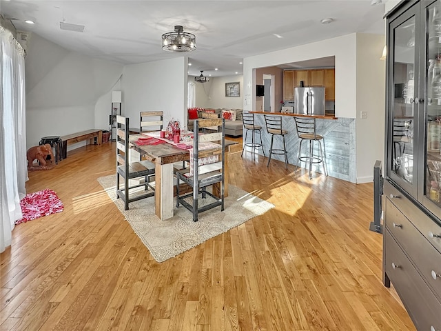 dining space featuring light hardwood / wood-style flooring