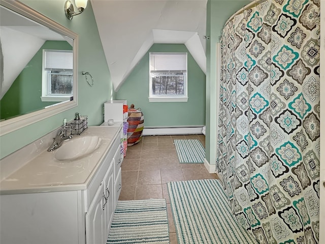 bathroom featuring vanity, plenty of natural light, tile patterned floors, and baseboard heating