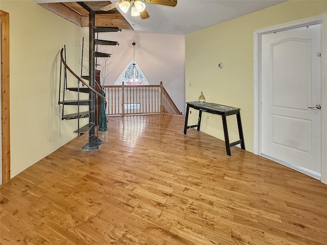 unfurnished living room featuring ceiling fan and light wood-type flooring