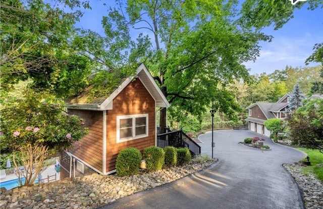 view of side of property featuring a garage