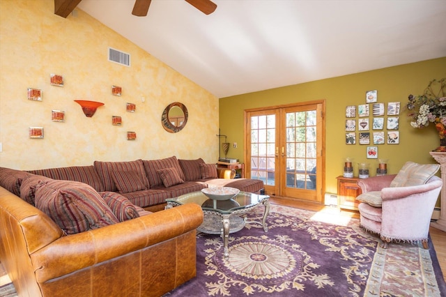 living room with french doors, visible vents, a baseboard heating unit, wood finished floors, and high vaulted ceiling