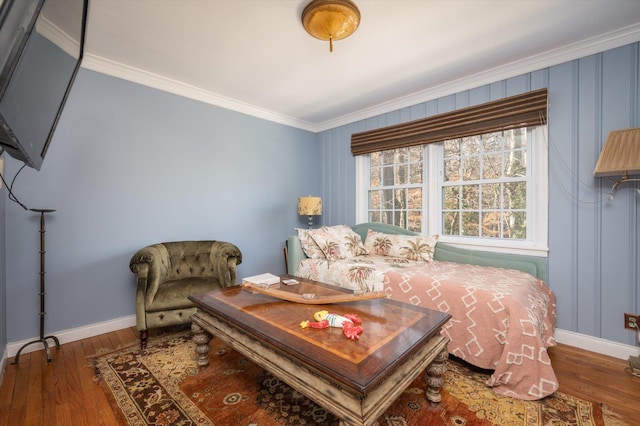 bedroom with ornamental molding and wood-type flooring