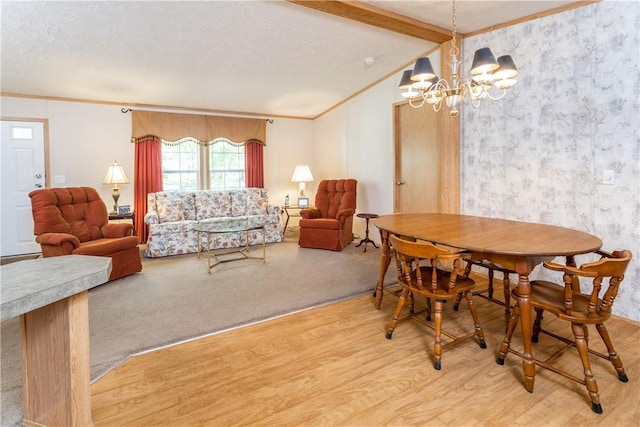 dining area with vaulted ceiling with beams, a notable chandelier, ornamental molding, a textured ceiling, and light wood-type flooring