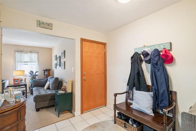 mudroom featuring baseboards and light tile patterned floors