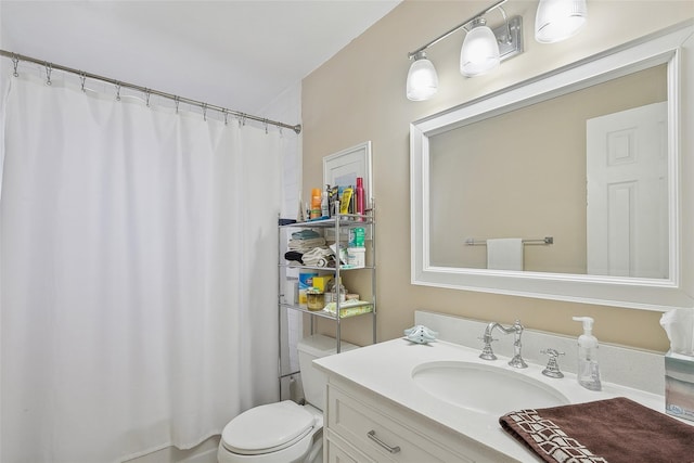 bathroom with toilet and vanity