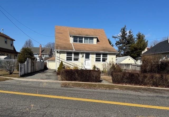 view of front facade with an outbuilding and a garage