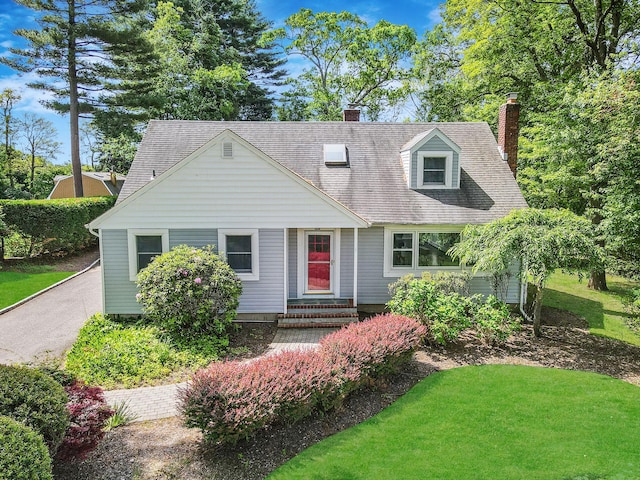 10 Clearbrook Dr, Smithtown, NY 11787 - cape cod-style house with a chimney and a front yard