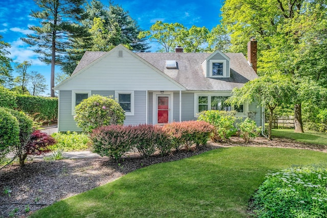 10 Clearbrook Dr, Smithtown, NY 11787 - view of front facade with a front yard, a chimney, and a shingled roof