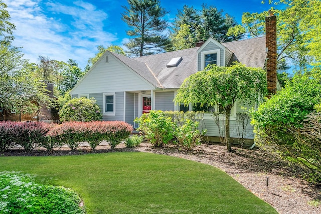 10 Clearbrook Dr, Smithtown, NY 11787 - view of front of property with a front lawn, a chimney, and a shingled roof