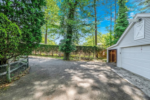 10 Clearbrook Dr, Smithtown, NY 11787 - exterior space with asphalt driveway and a garage
