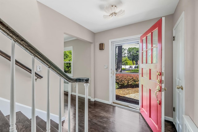 10 Clearbrook Dr, Smithtown, NY 11787 - entrance foyer with plenty of natural light, stairs, dark wood-type flooring, and baseboards