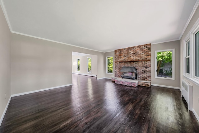 10 Clearbrook Dr, Smithtown, NY 11787 - unfurnished living room with radiator, plenty of natural light, dark wood-type flooring, a baseboard radiator, and crown molding