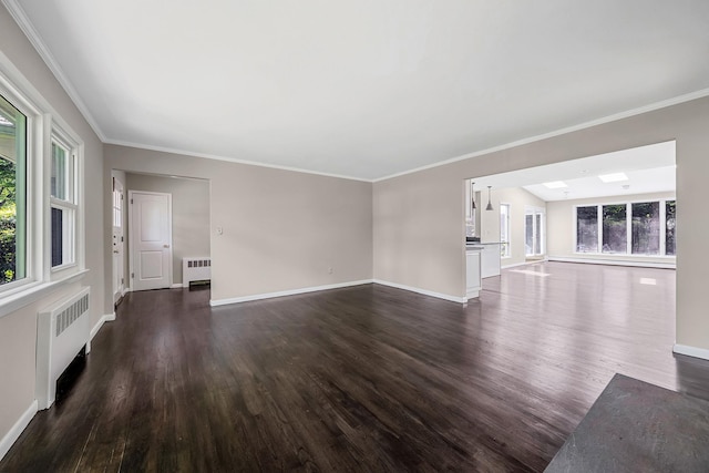 10 Clearbrook Dr, Smithtown, NY 11787 - unfurnished living room featuring radiator, dark wood-style floors, plenty of natural light, and crown molding