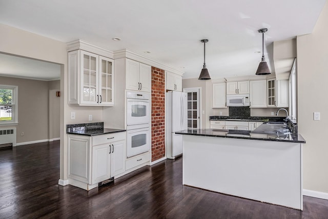 10 Clearbrook Dr, Smithtown, NY 11787 - kitchen with white appliances, baseboards, dark countertops, dark wood-type flooring, and ornamental molding