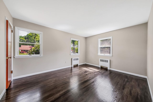 10 Clearbrook Dr, Smithtown, NY 11787 - empty room featuring radiator heating unit, wood finished floors, and baseboards