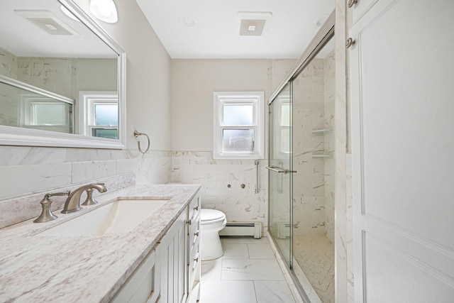 10 Clearbrook Dr, Smithtown, NY 11787 - bathroom featuring a baseboard radiator, toilet, vanity, a stall shower, and tile walls