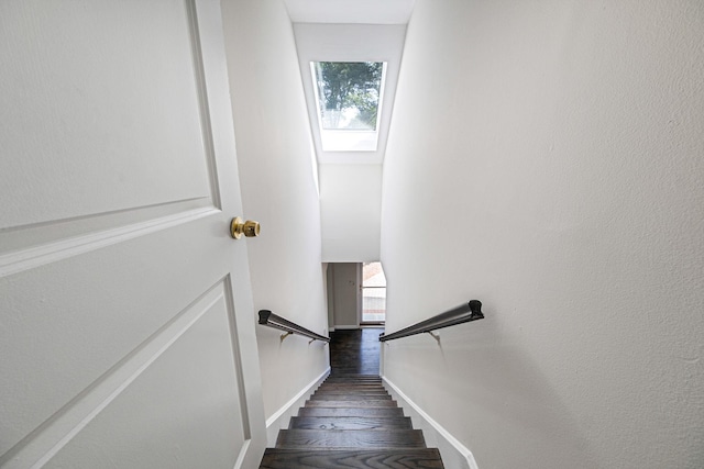 10 Clearbrook Dr, Smithtown, NY 11787 - stairway with a skylight, wood finished floors, and baseboards