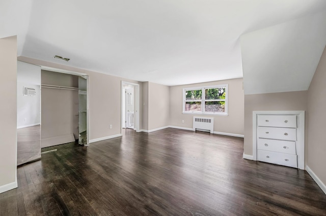 10 Clearbrook Dr, Smithtown, NY 11787 - unfurnished bedroom featuring radiator, wood finished floors, baseboards, and a closet