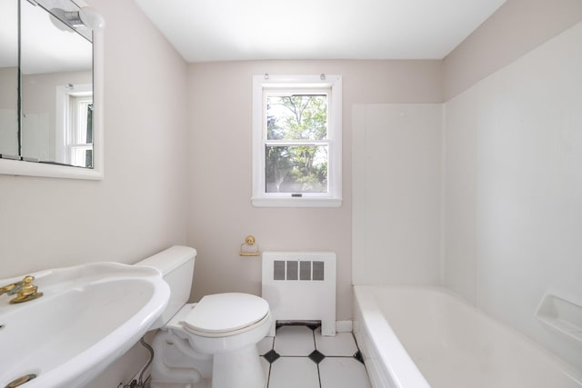 10 Clearbrook Dr, Smithtown, NY 11787 - full bathroom with radiator, a sink, toilet, and tile patterned floors