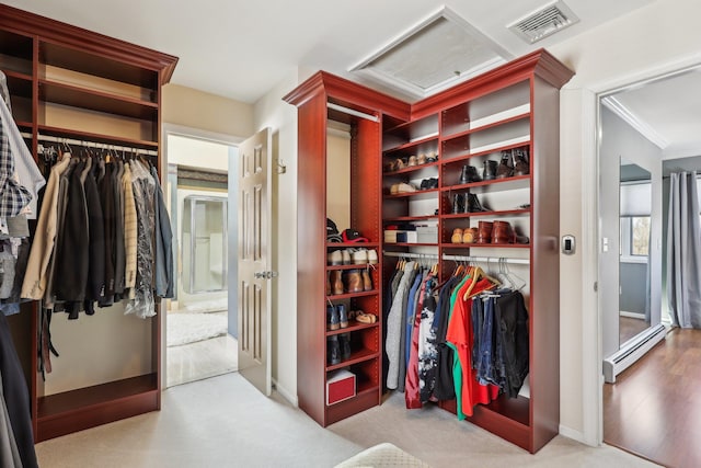 walk in closet featuring baseboard heating