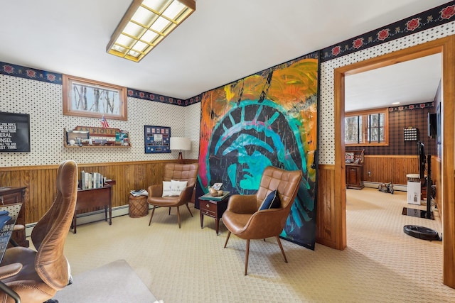 sitting room with a baseboard heating unit and light colored carpet