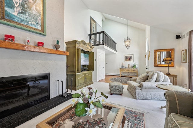 living room with baseboard heating, high vaulted ceiling, and a high end fireplace