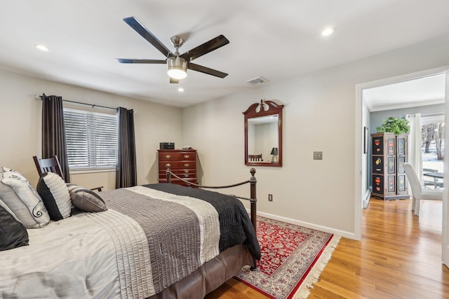 bedroom featuring ceiling fan and light hardwood / wood-style floors