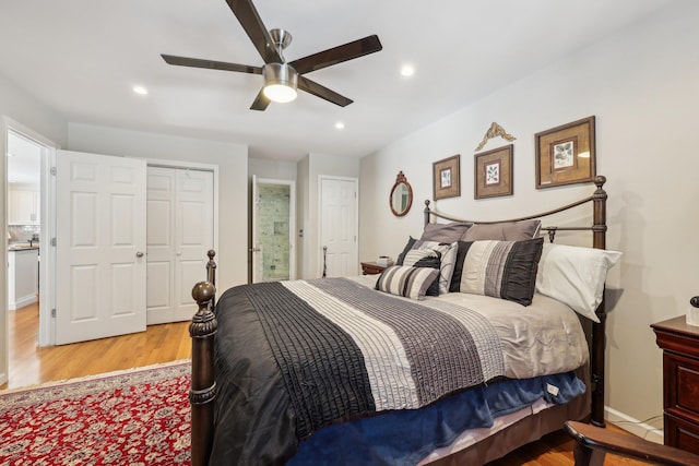 bedroom featuring ceiling fan and light hardwood / wood-style flooring