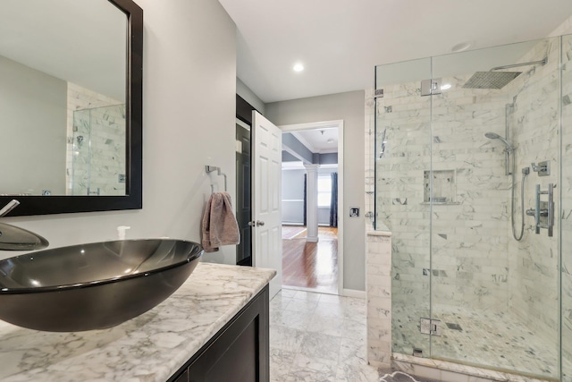 bathroom with vanity and an enclosed shower