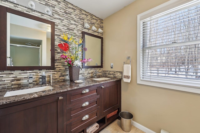 bathroom with vanity and backsplash