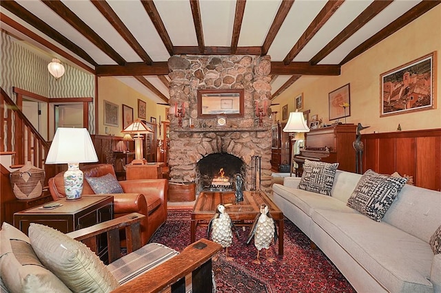 living room featuring a fireplace and vaulted ceiling with beams