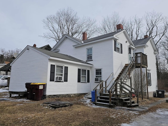 rear view of house with cooling unit