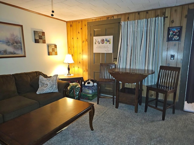 interior space with carpet floors, ornamental molding, and wood walls