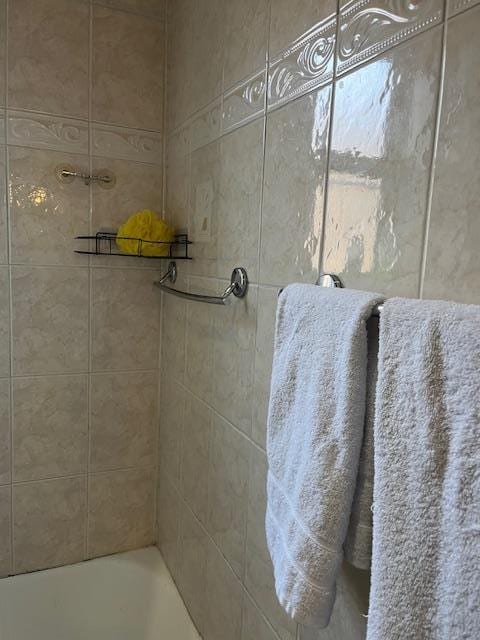 bathroom featuring a tub to relax in