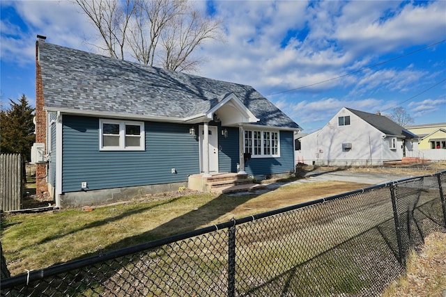 bungalow-style home featuring a front yard