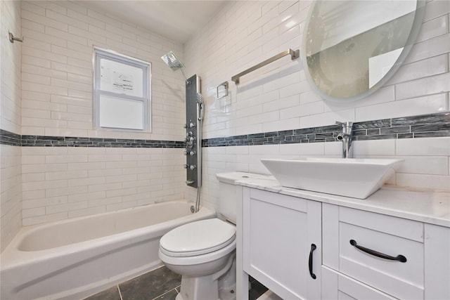 full bathroom with toilet, tiled shower / bath, tile walls, vanity, and backsplash