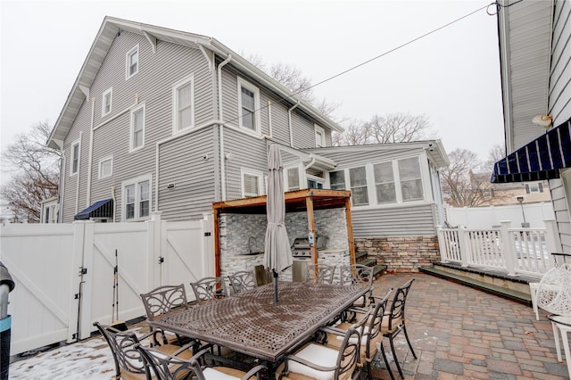 rear view of house with a patio area